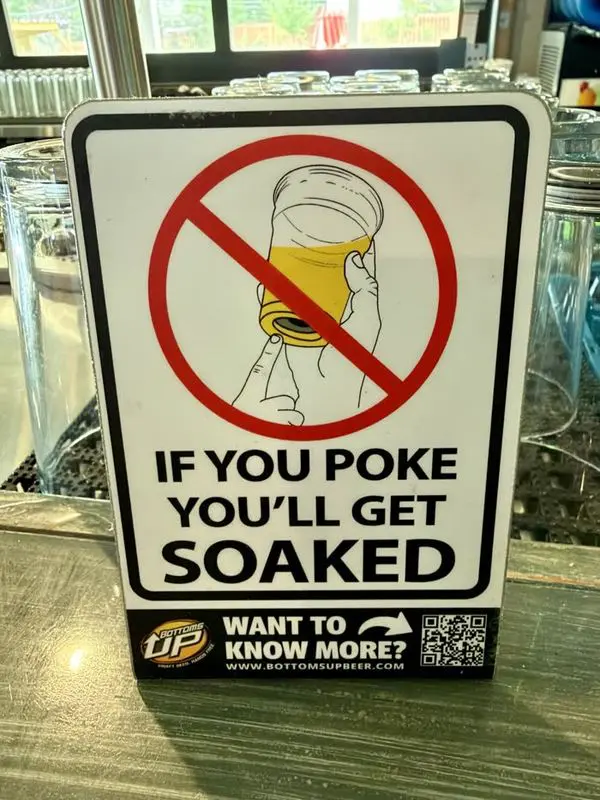 Sign reading: If you poke you will get soaked