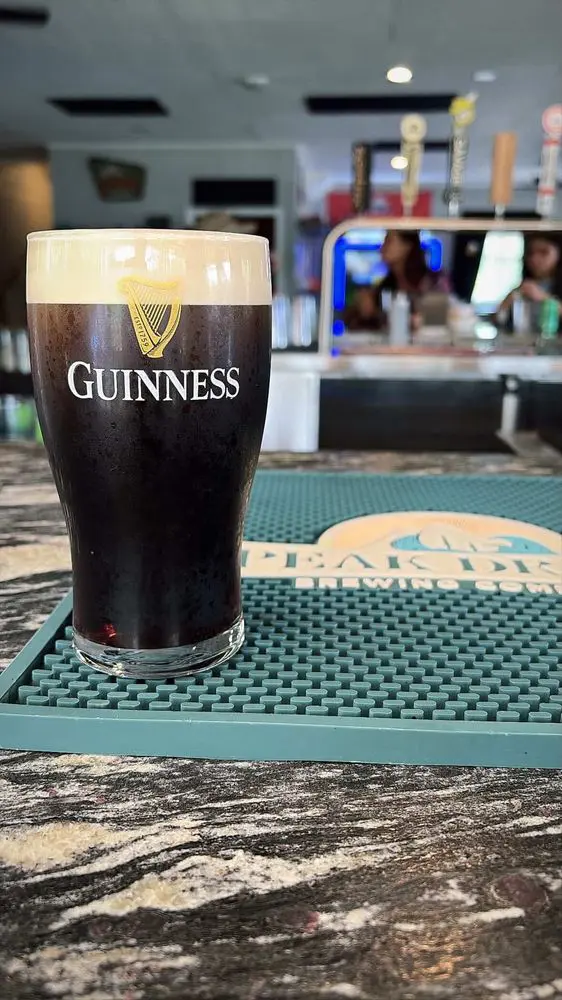 A pint of Guinness on the bar