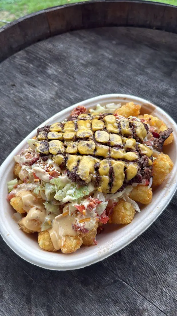 Ironwood BBQ smash-burger tots served on a barrel top